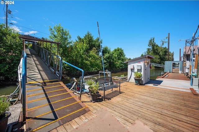 wooden terrace with a water view