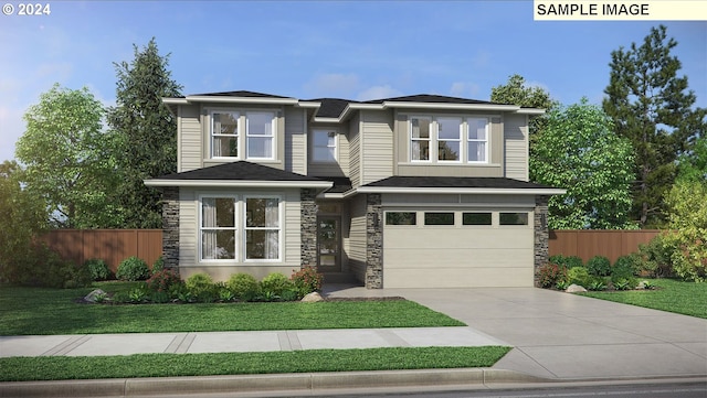 view of front of house with a front yard and a garage