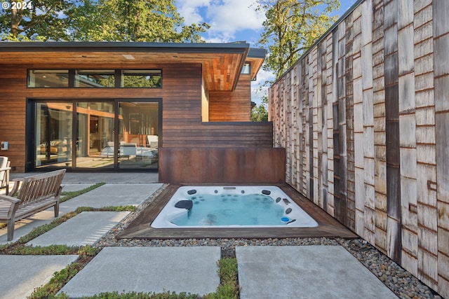 view of patio featuring an outdoor hot tub