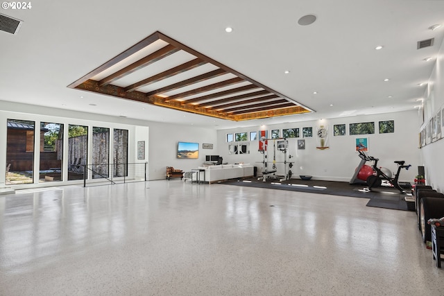 workout room featuring plenty of natural light