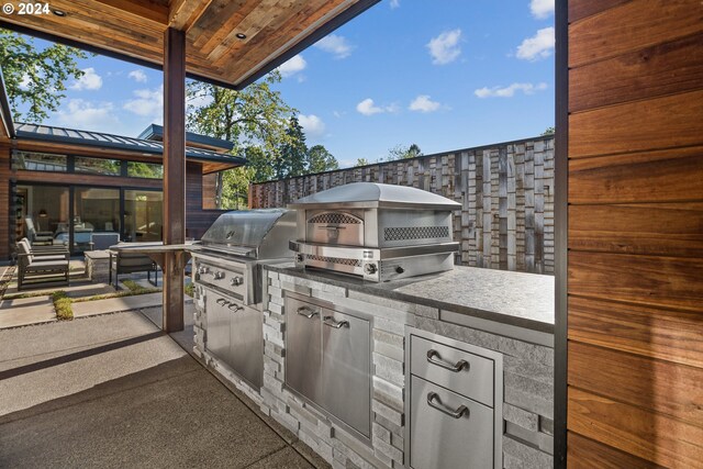 view of patio featuring grilling area and exterior kitchen