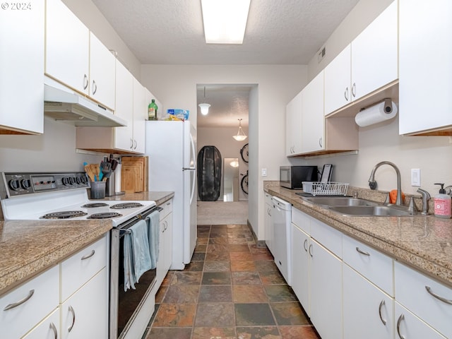 kitchen featuring a textured ceiling, white appliances, white cabinetry, and sink