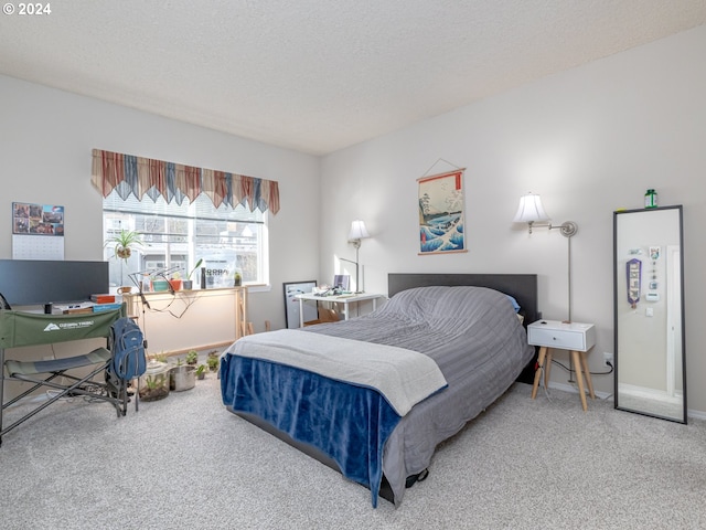 carpeted bedroom with a textured ceiling