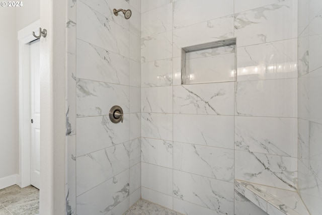 bathroom featuring a tile shower