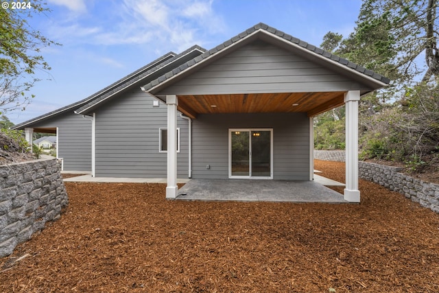 back of house with a patio