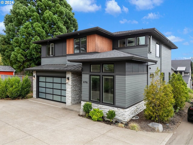 prairie-style house featuring a garage