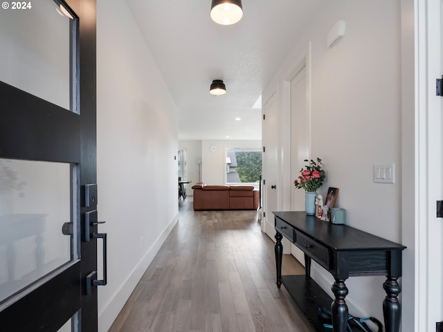 hallway featuring light wood-type flooring