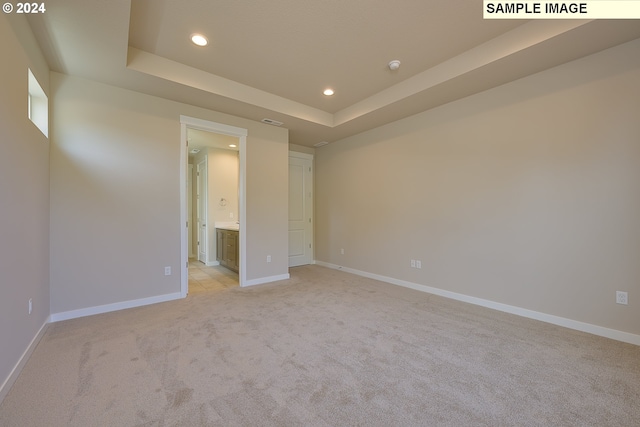 17374 SW Kalapuya Ln Unit 70, Sherwood, OR 97140 - unfurnished bedroom featuring recessed lighting, light colored carpet, baseboards, and a tray ceiling