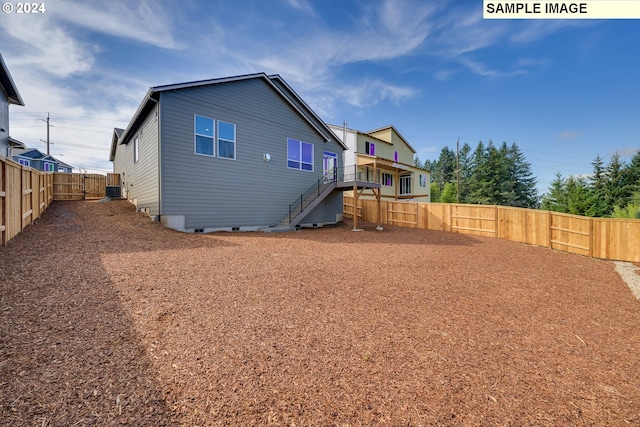 17374 SW Kalapuya Ln Unit 70, Sherwood, OR 97140 - rear view of property with stairs, crawl space, and a fenced backyard