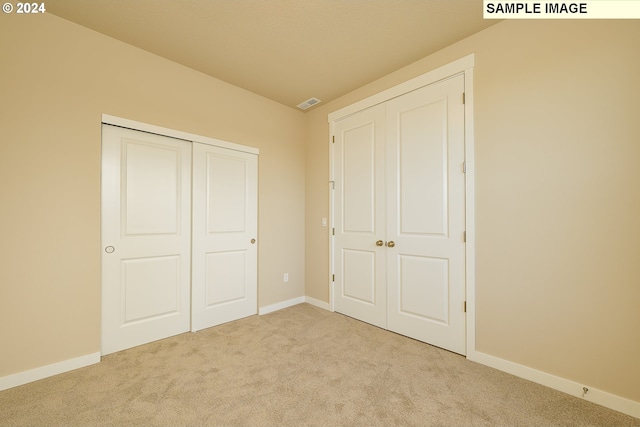 17374 SW Kalapuya Ln Unit 70, Sherwood, OR 97140 - unfurnished bedroom with carpet floors, baseboards, and a closet