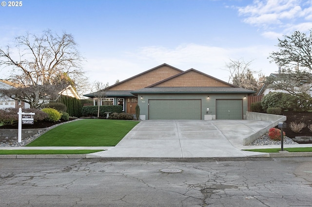 view of front of home featuring a front lawn and a garage