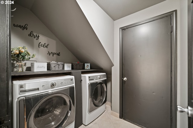 washroom featuring light tile patterned floors and separate washer and dryer