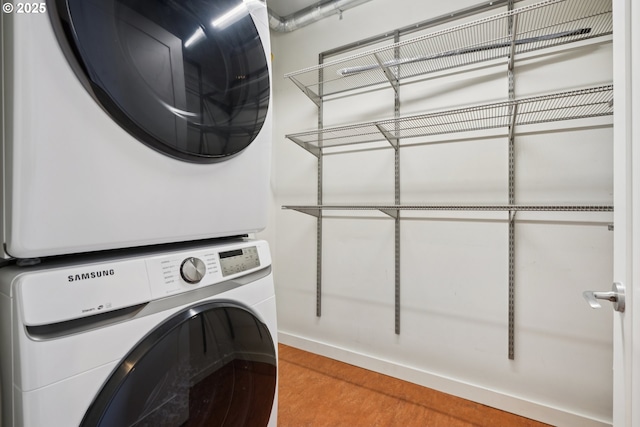 1025 NW Couch St Unit 716, Portland, OR 97209 - laundry room featuring estacked washer and dryer