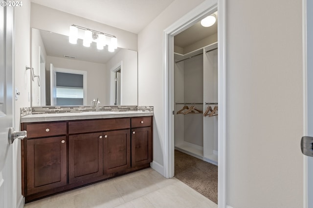 bathroom featuring tile patterned floors and vanity