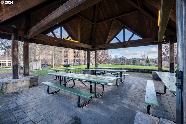 surrounding community with a gazebo and a lawn