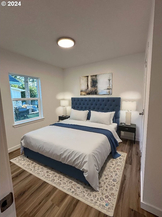 bedroom featuring dark wood-type flooring