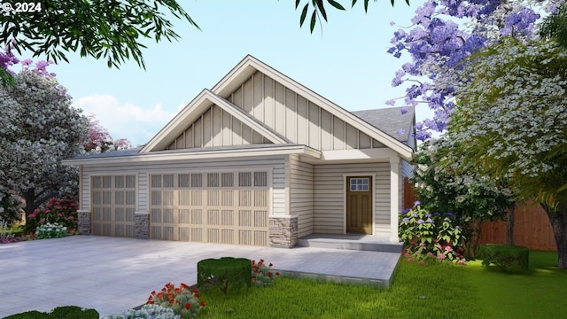 view of front of house with a garage and a front lawn