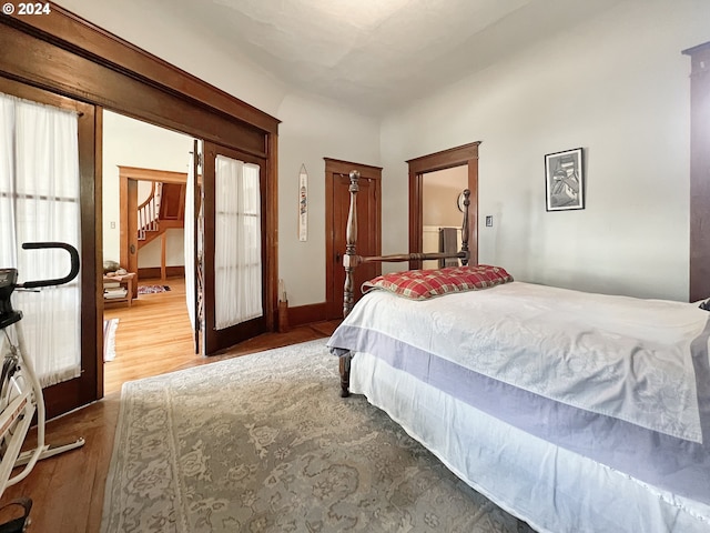 bedroom with hardwood / wood-style floors