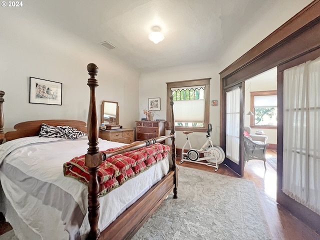 bedroom featuring wood-type flooring