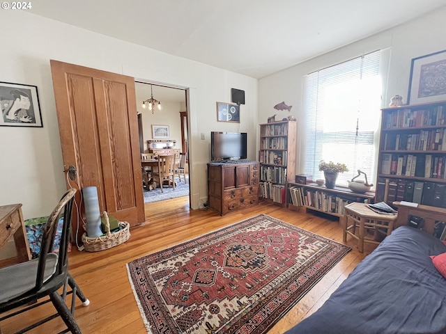 living room featuring hardwood / wood-style floors and a chandelier