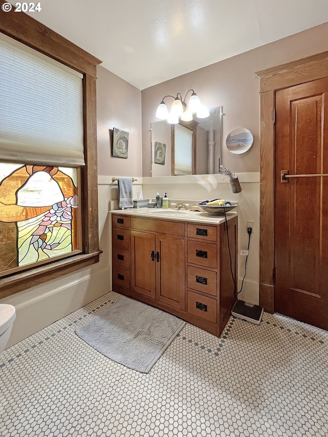 bathroom featuring vanity and toilet