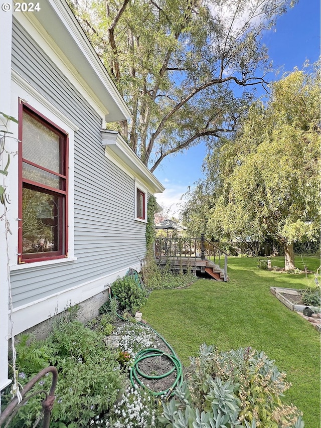 view of yard featuring a wooden deck