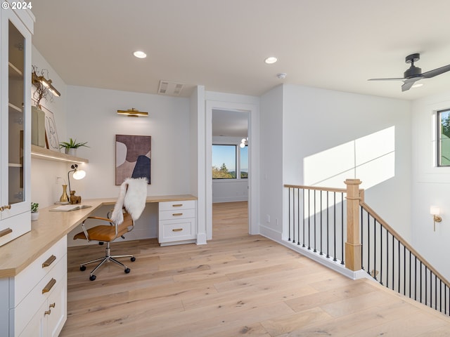 office space with ceiling fan and light wood-type flooring