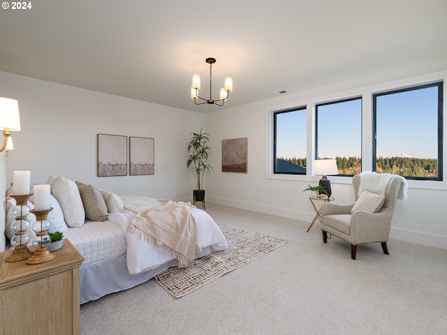 bedroom featuring light carpet and a chandelier