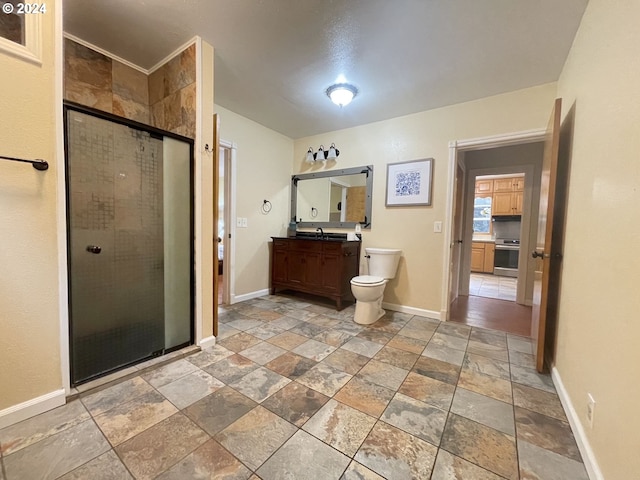 bathroom featuring walk in shower, vanity, and toilet