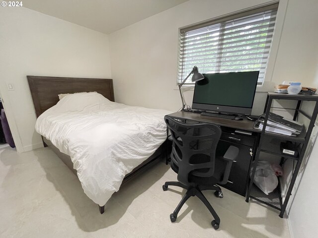 bedroom featuring light carpet