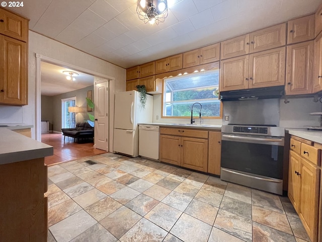 kitchen with white appliances and sink