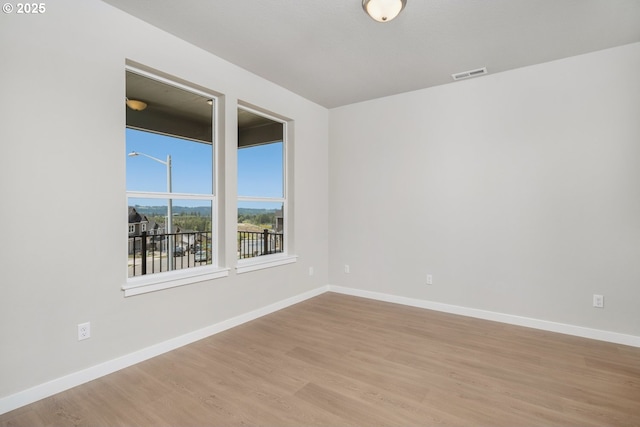 1643 NE Josephine Ct Unit 175, Estacada, OR 97023 - spare room featuring wood finished floors and baseboards