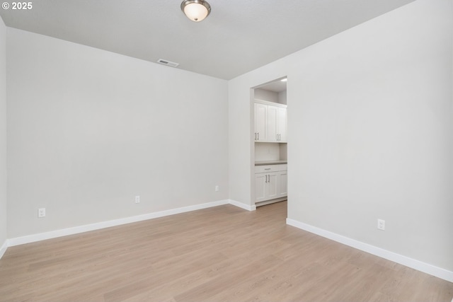 1643 NE Josephine Ct Unit 175, Estacada, OR 97023 - spare room with light wood-style flooring and baseboards