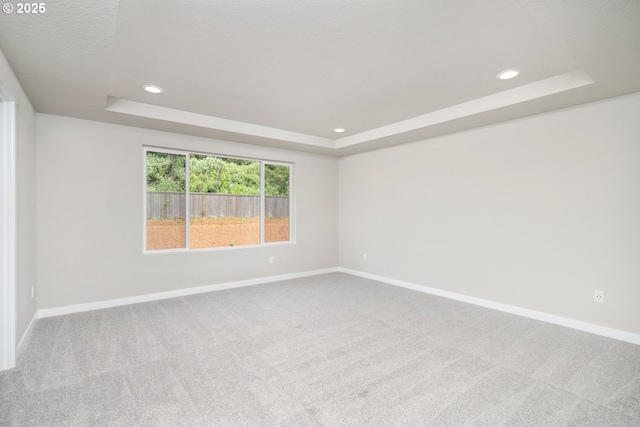 1643 NE Josephine Ct Unit 175, Estacada, OR 97023 - carpeted empty room featuring a raised ceiling, baseboards, and recessed lighting