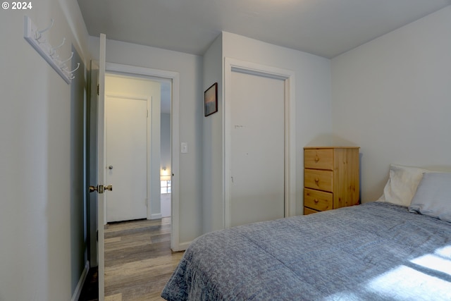 bedroom with light hardwood / wood-style floors