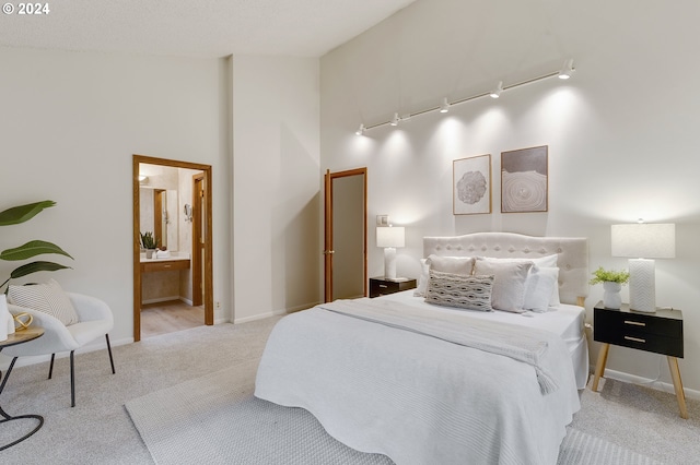 office area with light carpet, beam ceiling, and high vaulted ceiling