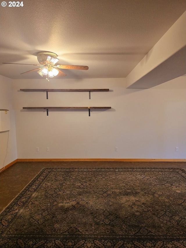 spare room featuring ceiling fan and a textured ceiling