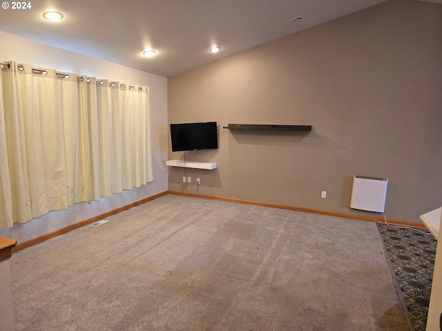 unfurnished living room featuring carpet floors