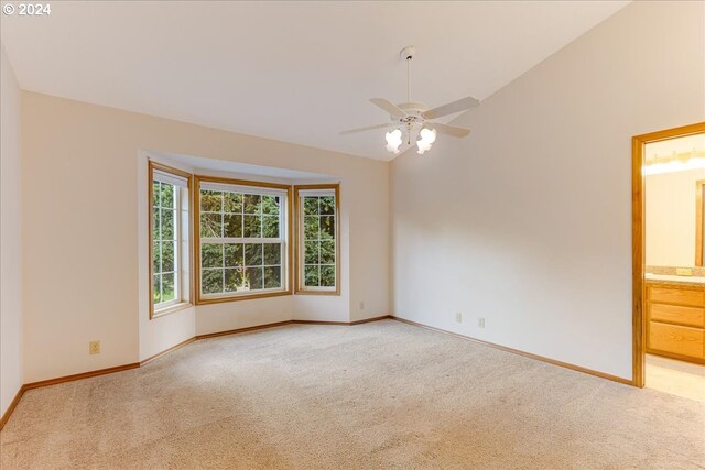 unfurnished room with carpet flooring, ceiling fan, and lofted ceiling