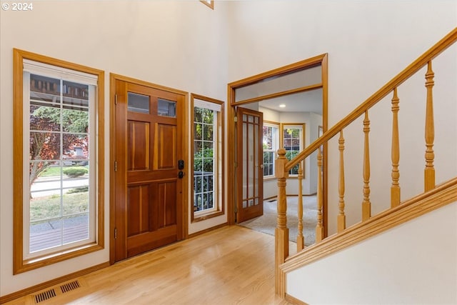 entryway with light hardwood / wood-style floors