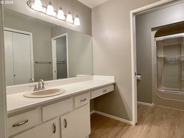 bathroom with wood-type flooring and vanity