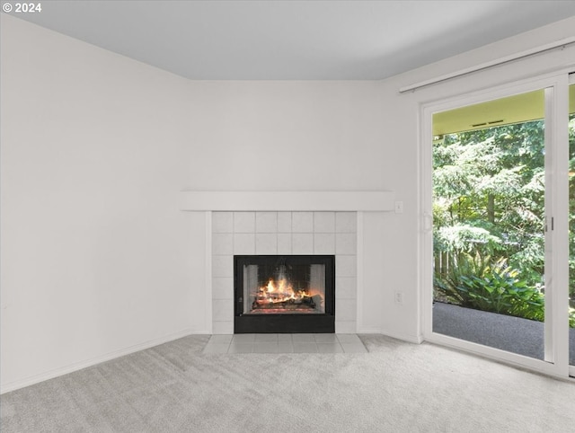 room details featuring carpet and a fireplace