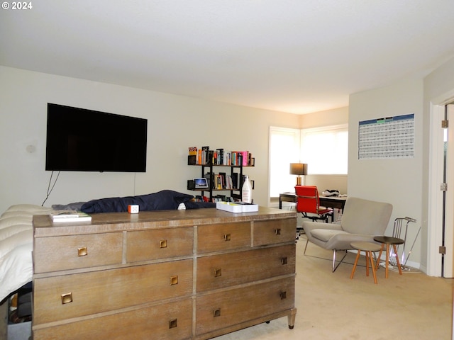 bedroom featuring light colored carpet