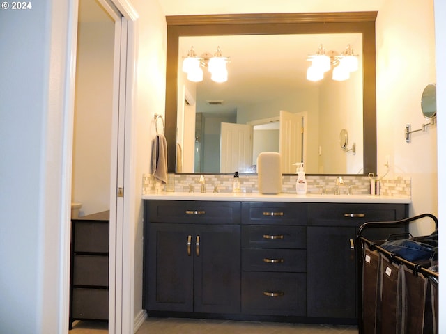 bathroom with vanity and backsplash