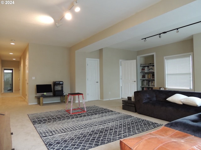 living room with carpet floors and rail lighting