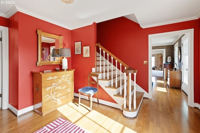 4700 SW Northwood Ave, Portland, OR 97035 - stairs with wood finished floors, ornamental molding, and baseboards
