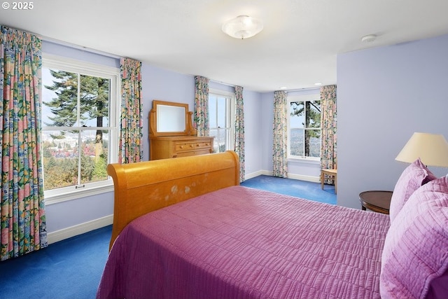 4700 SW Northwood Ave, Portland, OR 97035 - bedroom featuring dark carpet, baseboards, and multiple windows