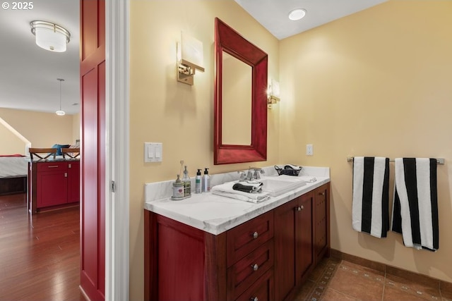 4700 SW Northwood Ave, Portland, OR 97035 - bathroom featuring vanity, baseboards, and wood finished floors