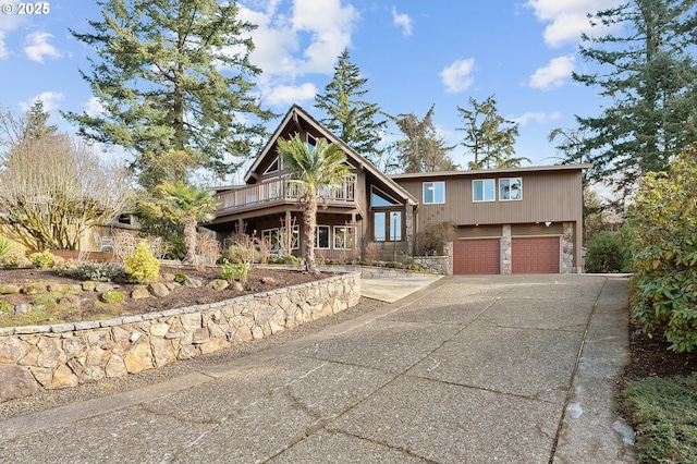 view of front of property featuring a deck and a garage