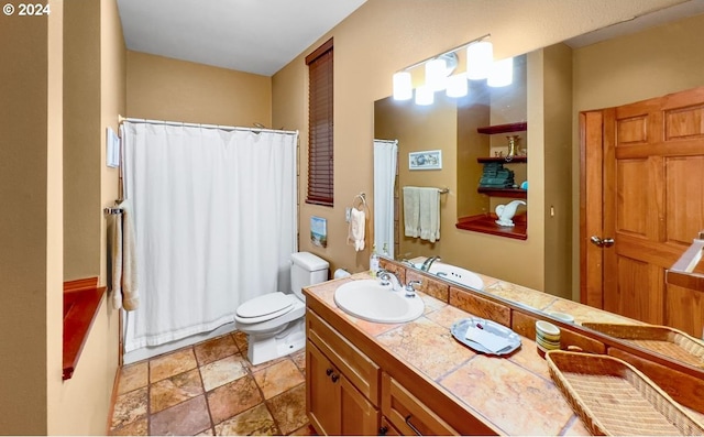 bathroom with a shower with shower curtain, vanity, and toilet